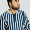 Man wearing old money polo with blue and white stripes, front view with zip collar
